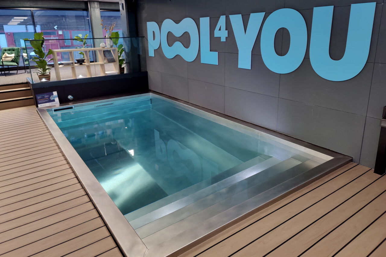 Water filled steel pool pictured in showroom.